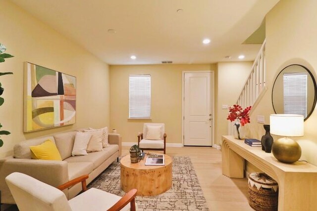 sitting room featuring light hardwood / wood-style floors