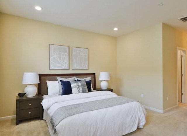 bedroom featuring light carpet