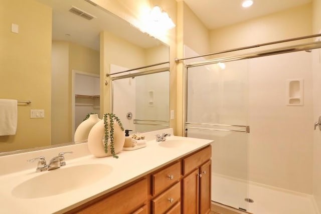 bathroom with vanity and walk in shower