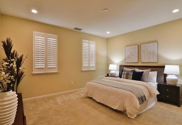 bedroom featuring light carpet