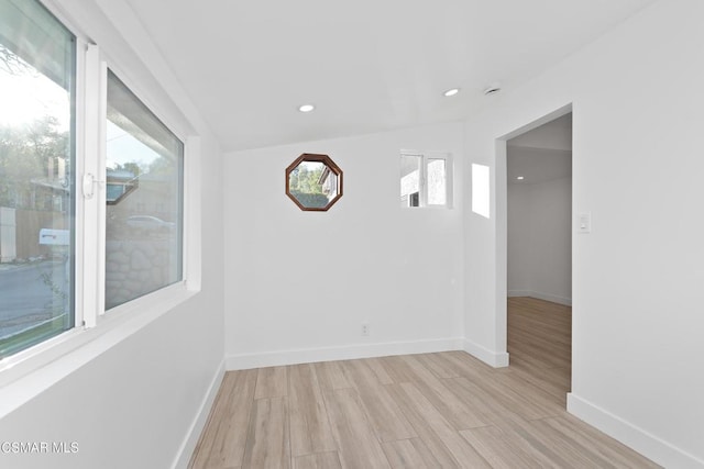 spare room with light hardwood / wood-style floors