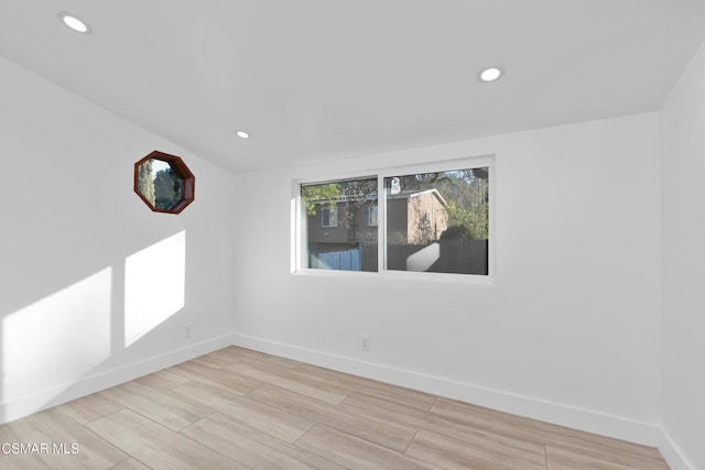 spare room featuring light hardwood / wood-style floors