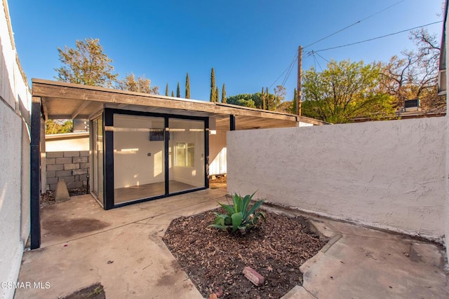 rear view of house featuring a patio