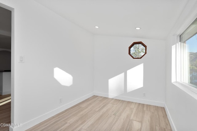 unfurnished room featuring light hardwood / wood-style flooring