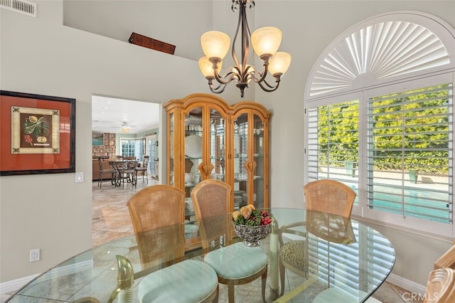 dining room featuring an inviting chandelier and light tile patterned floors