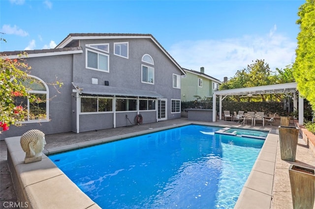 view of pool with a gazebo, a patio, and an in ground hot tub