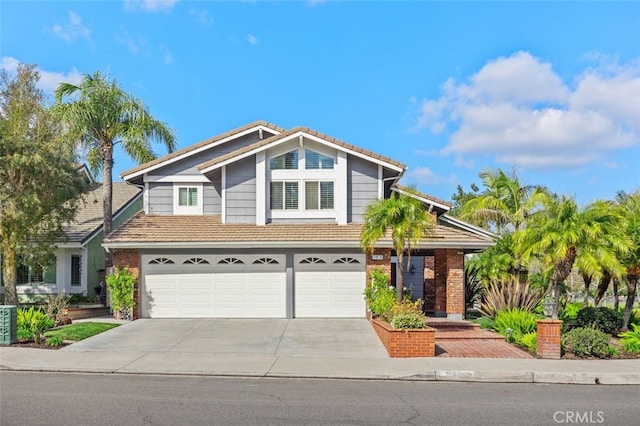 view of front of house featuring brick siding, a garage, a tile roof, and concrete driveway