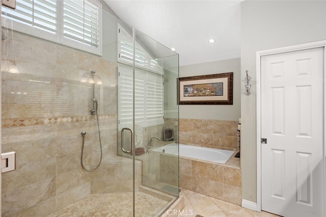 bathroom with separate shower and tub and tile patterned floors