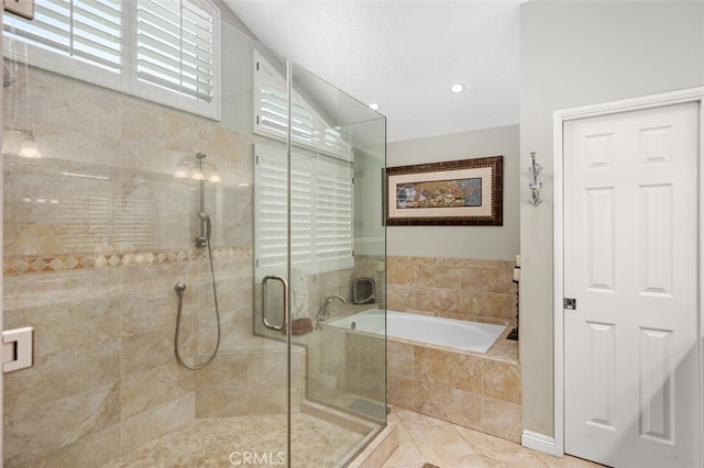 bathroom featuring a shower stall and a garden tub