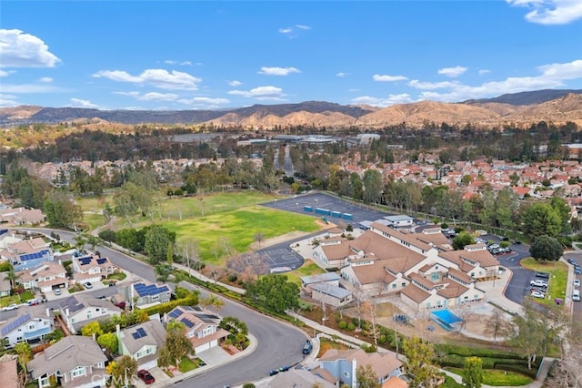 birds eye view of property featuring a mountain view and a residential view