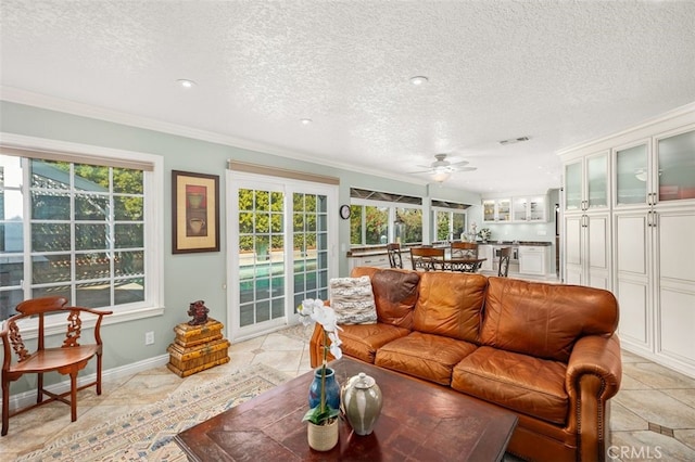 sunroom featuring visible vents and plenty of natural light