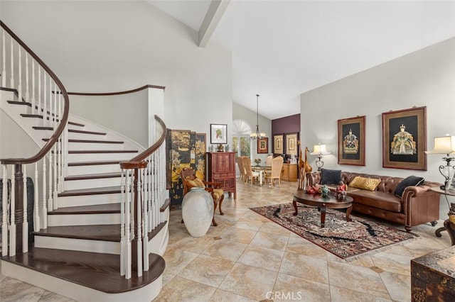 living room with beam ceiling, an inviting chandelier, and high vaulted ceiling