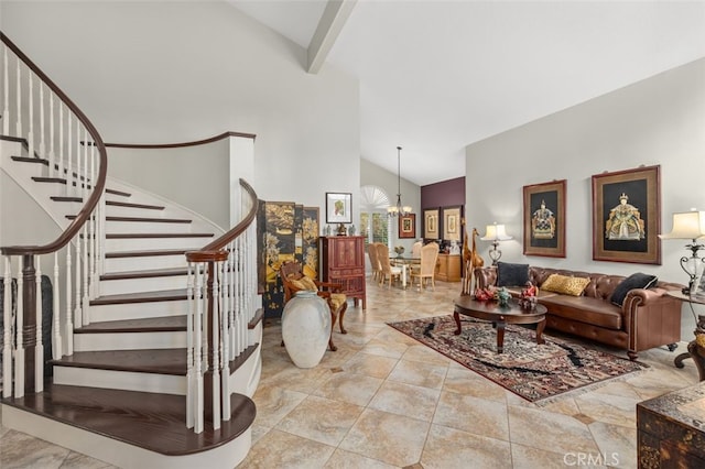 living room with high vaulted ceiling, a notable chandelier, and stairway