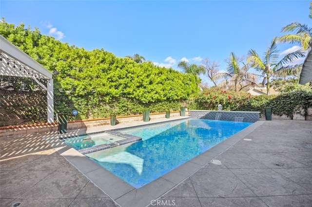 view of pool featuring a patio and a pool with connected hot tub