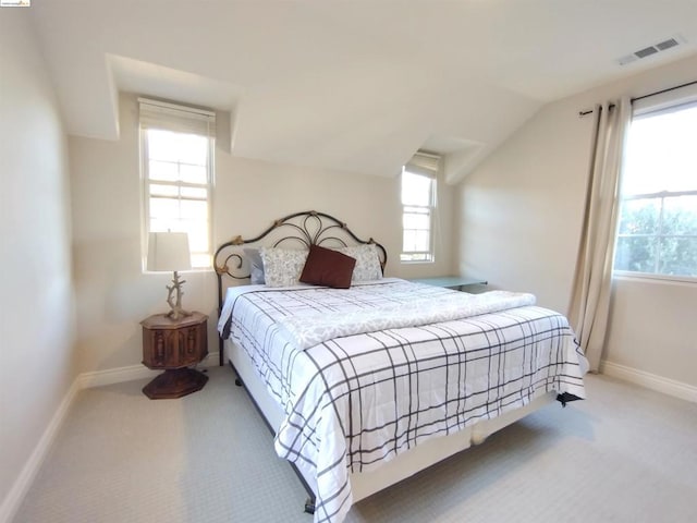 carpeted bedroom featuring vaulted ceiling