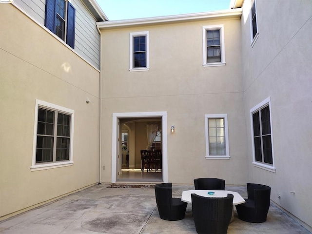 rear view of property with a patio area