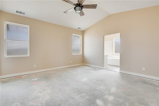 empty room with ceiling fan and vaulted ceiling