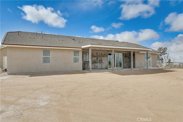 back of property featuring a patio area