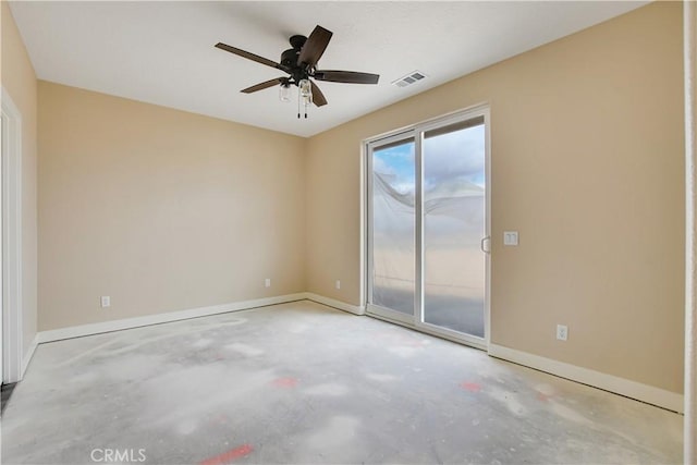 unfurnished room featuring ceiling fan and concrete flooring