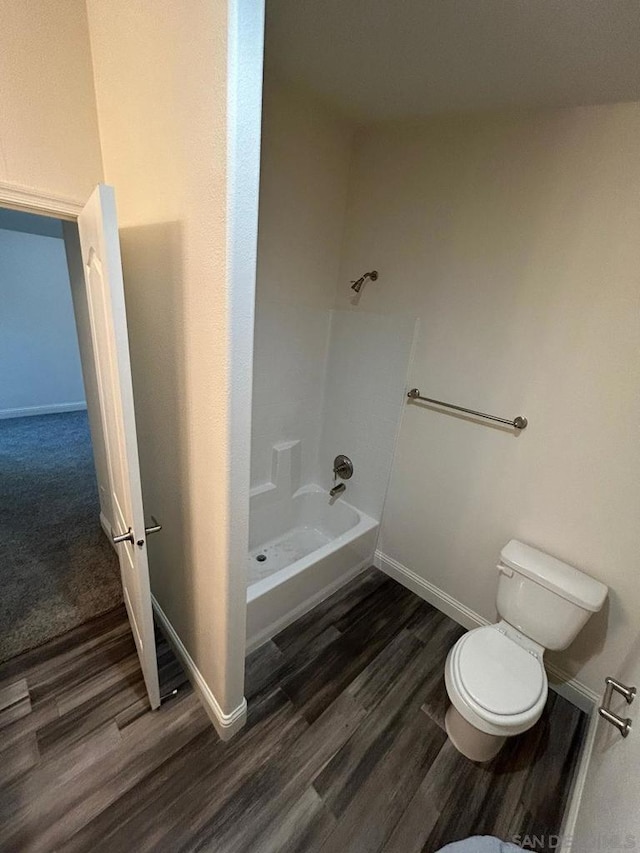 bathroom with wood-type flooring and toilet