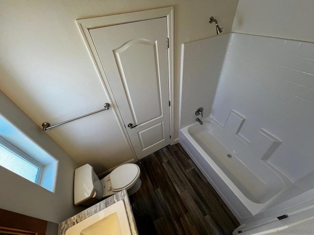 full bathroom featuring shower / bathtub combination, vanity, toilet, and hardwood / wood-style floors