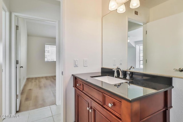 bathroom with tile patterned floors and vanity