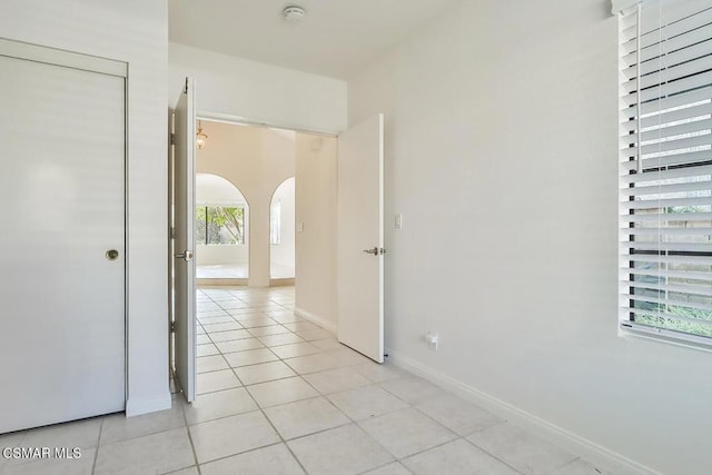 hallway with light tile patterned floors