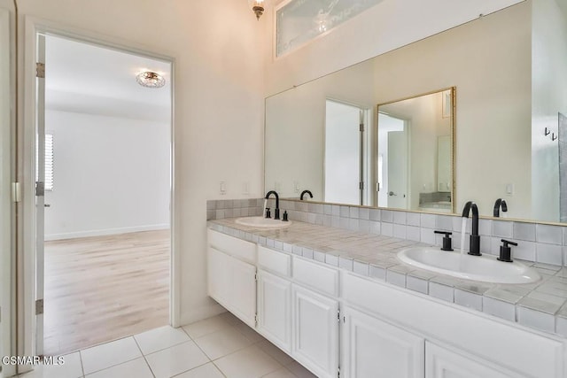 bathroom with vanity and tile patterned floors