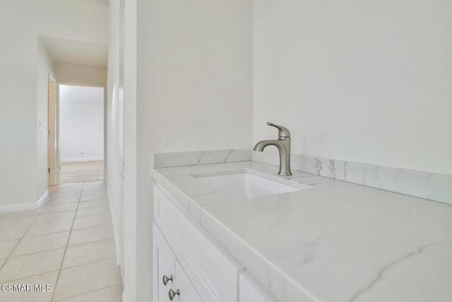 bathroom featuring tile patterned flooring and vanity