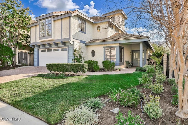 view of front facade with a garage and a front yard