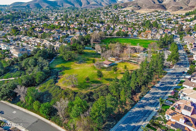 birds eye view of property featuring a mountain view