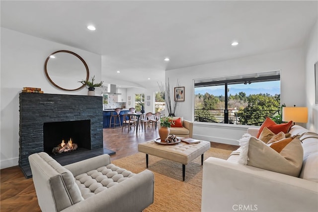 living room featuring parquet flooring and a fireplace