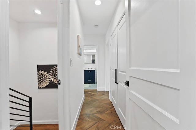 corridor with dark parquet flooring