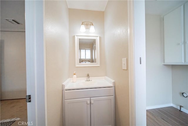 bathroom with vanity and wood-type flooring