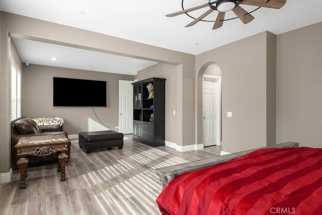 bedroom featuring hardwood / wood-style flooring and ceiling fan