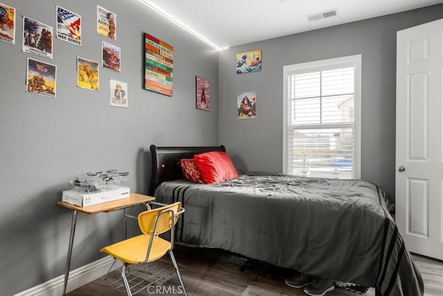 bedroom with wood-type flooring