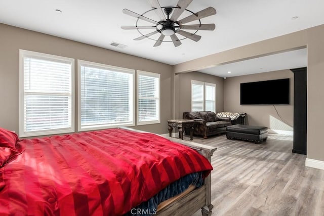 bedroom with hardwood / wood-style floors and ceiling fan