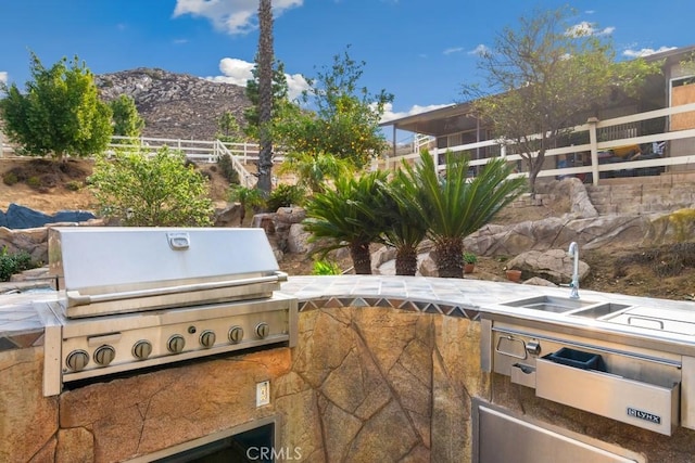 view of patio with a grill and a mountain view