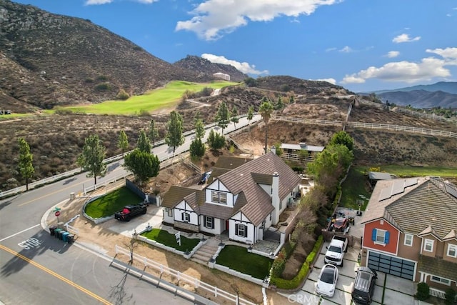 birds eye view of property with a mountain view