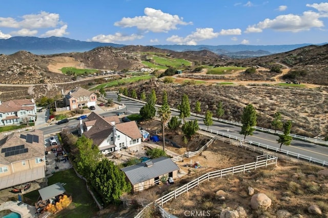 birds eye view of property featuring a mountain view