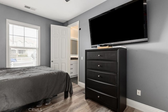 bedroom featuring wood-type flooring