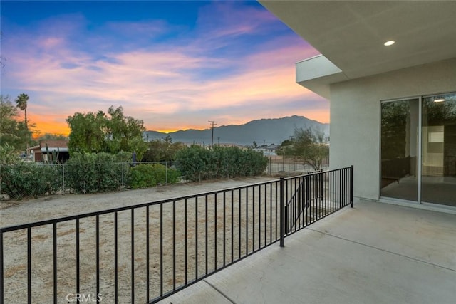 balcony at dusk with a mountain view