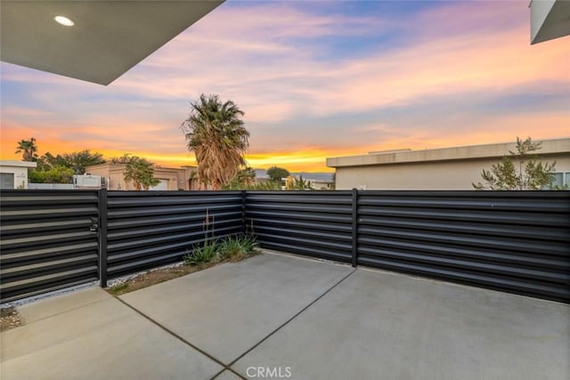 view of patio terrace at dusk