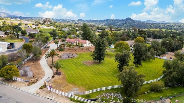 birds eye view of property with a mountain view