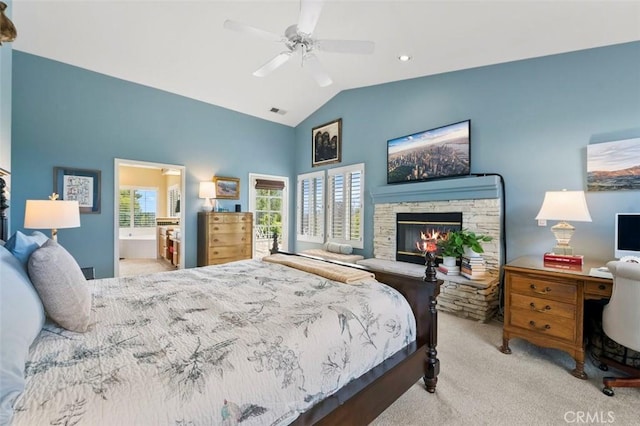 carpeted bedroom with multiple windows, a stone fireplace, lofted ceiling, and ceiling fan