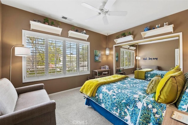 carpeted bedroom featuring ceiling fan