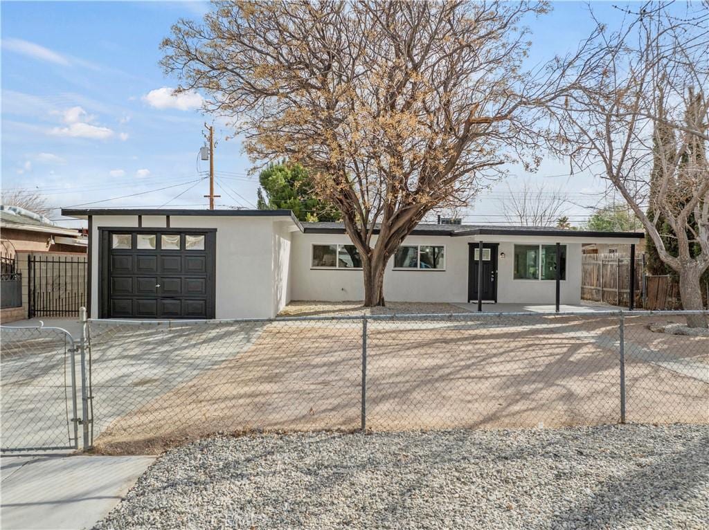 ranch-style home featuring a garage