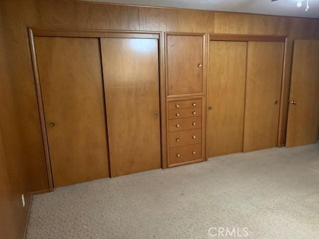14650 Pearl Ave, Clearlake, CA 95422 - bedroom featuring multiple closets and light carpet