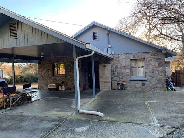 14650 Pearl Ave, Clearlake, CA 95422 - rear view of house with stone siding and a patio area