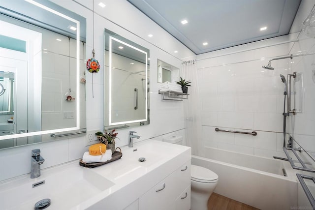 full bathroom featuring shower / bath combo, wood-type flooring, vanity, and toilet